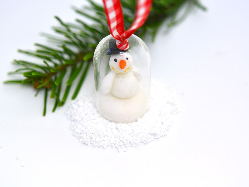 Bonhomme de neige sous sa cloche