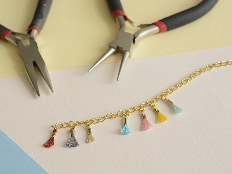Achat breloque mini-pompon - beige