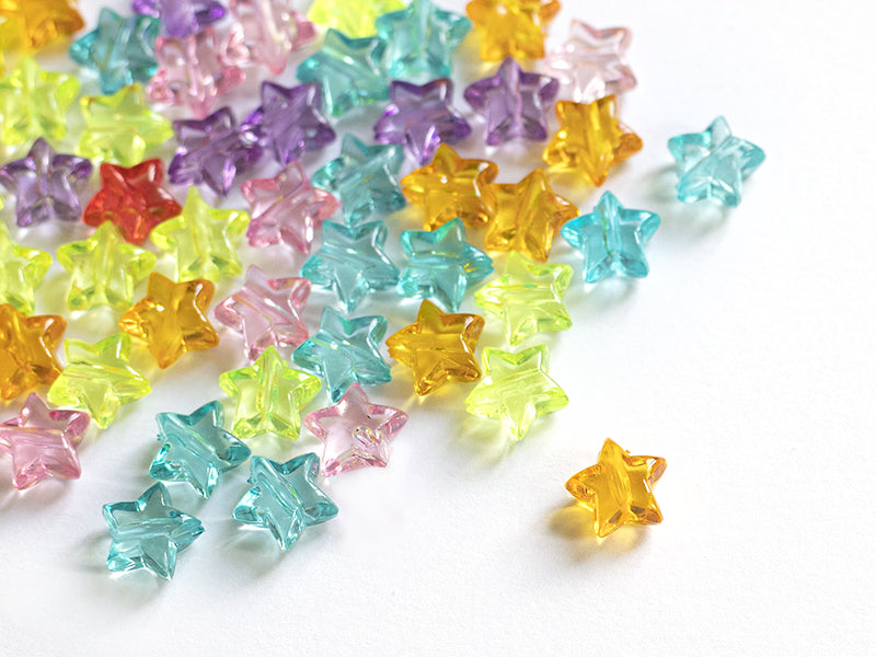 achat 50 perles en plastique - étoiles transparentes - multicolore
