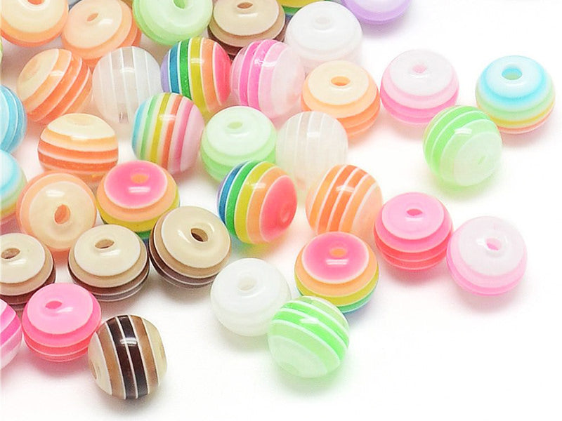 Achat 100 perles en plastique rondes 6 mm - rayures