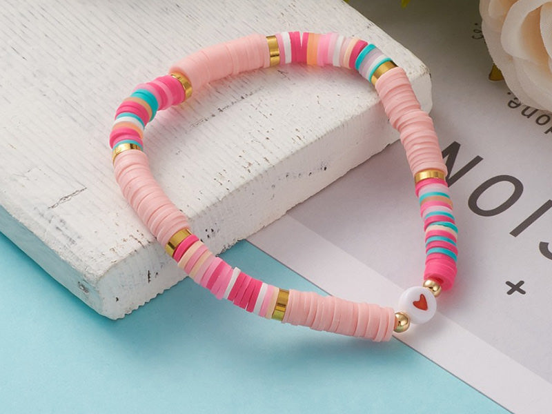 Achat Bracelet en perles heishi avec petit cœur - tons de rose