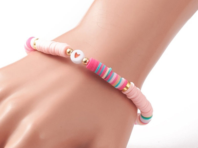 achat Bracelet en perles heishi avec petit cœur - tons de rose